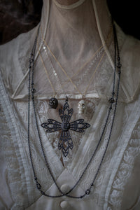 Victorian Carved Ebony and Bone Skull Pendants with Platinum and Diamond Eyes